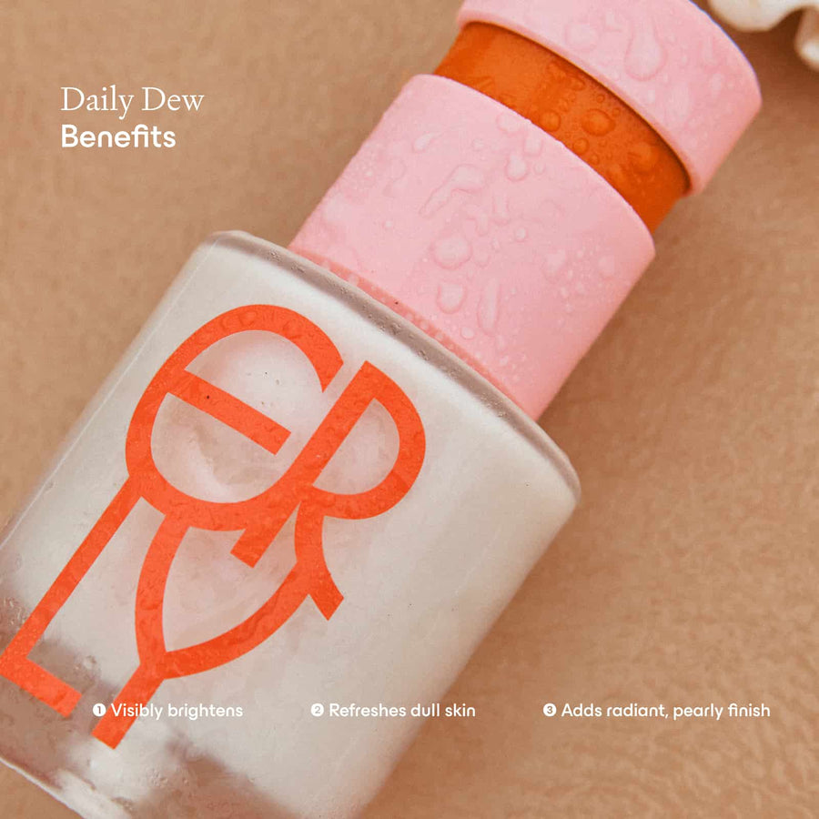 Close up of Daily Dew Serum Bottle with copy about benefits