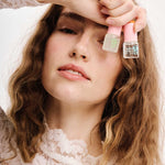 Model holding ERLY Mini Serum Bottles
