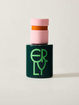 Green bottle with pink cap and orange middle section on a white background