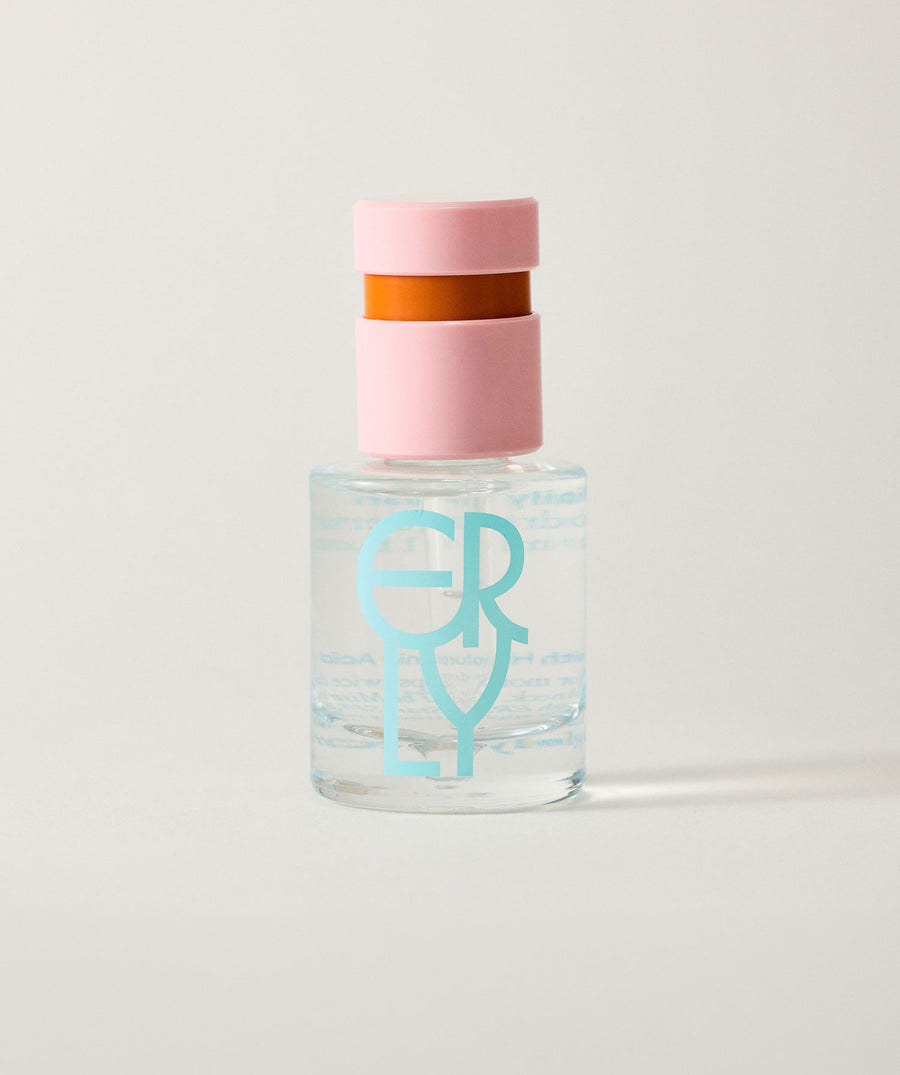 Clear bottle of ERLY Daily Splash with pink cap and 'ERLY' branding on a light gray background