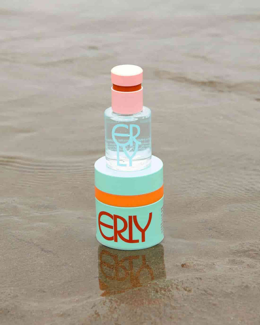 SPF moisturizer and serum skincare in the waves on a beach