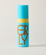 Blue cylindrical container with a yellow band and brown logo on a light gray background