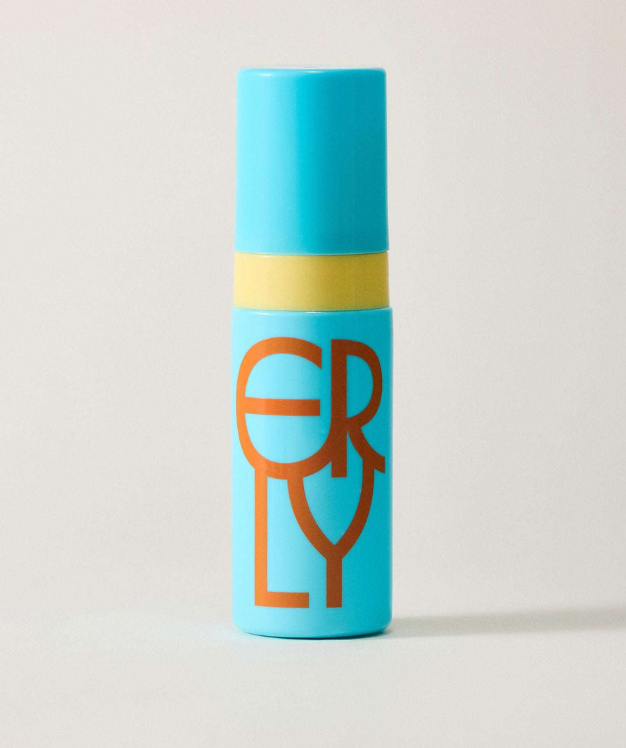 Blue cylindrical container with a yellow band and brown logo on a light gray background