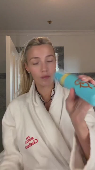 Video of woman in a robe using ERLY Face Foam to wash her face and then apply Daily Dew