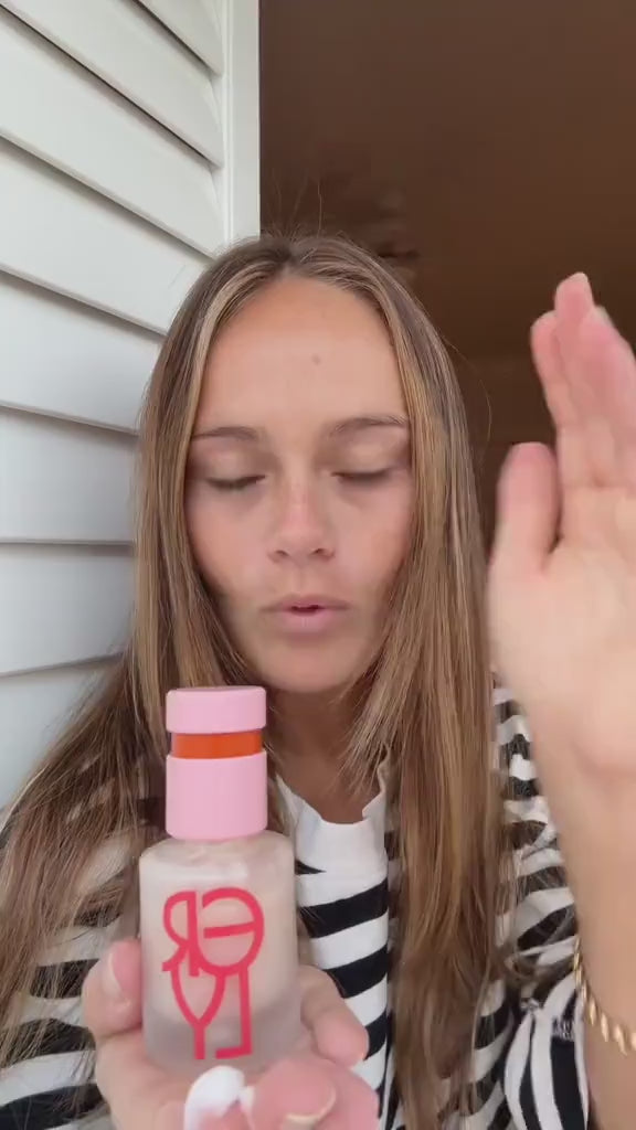 Close up video of woman applying Daily Dew Illuminating Serum