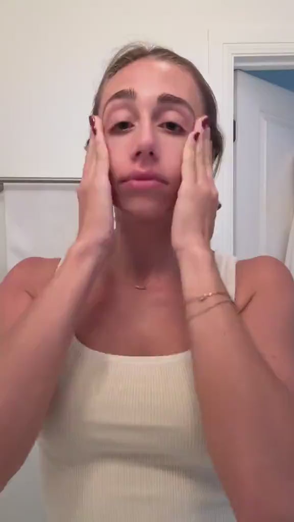 Woman applying ERLY Start to face