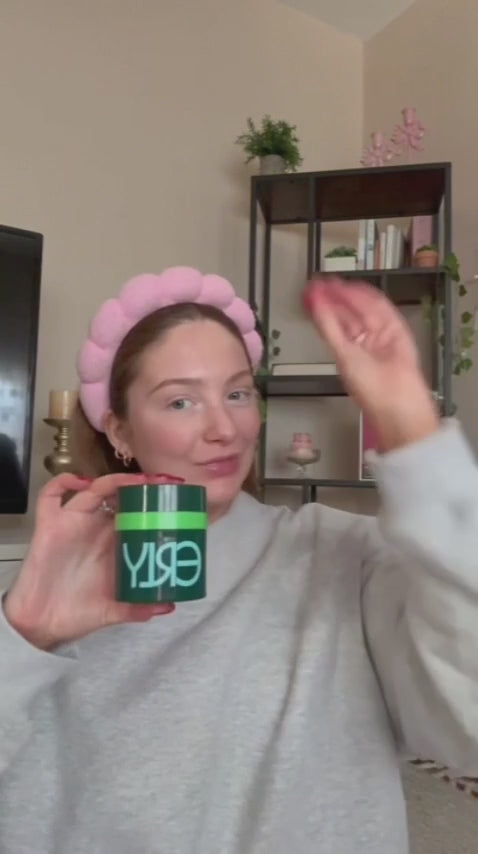 Woman in pink headband applying ERLY Night Moisturizer