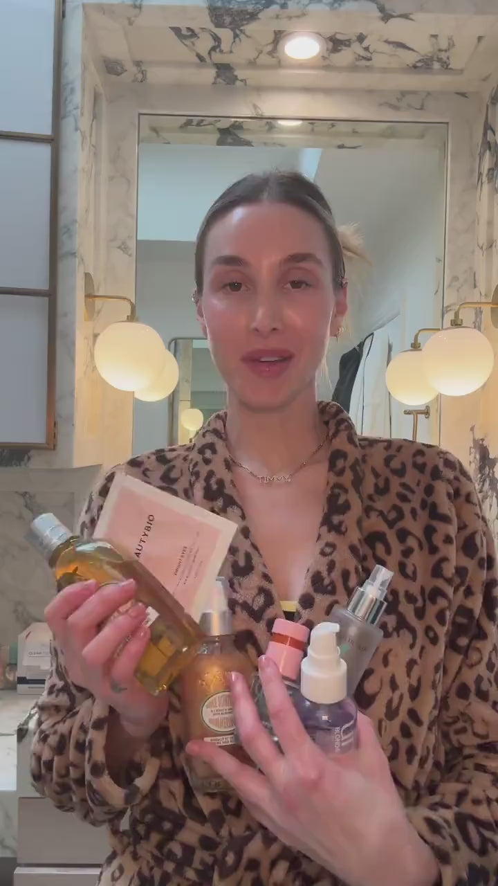 video of a woman talking about her skincare routine holding products