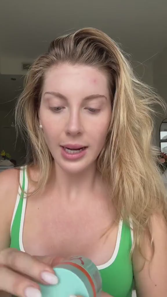 Woman with blonde hair applying ERLY Start to her face