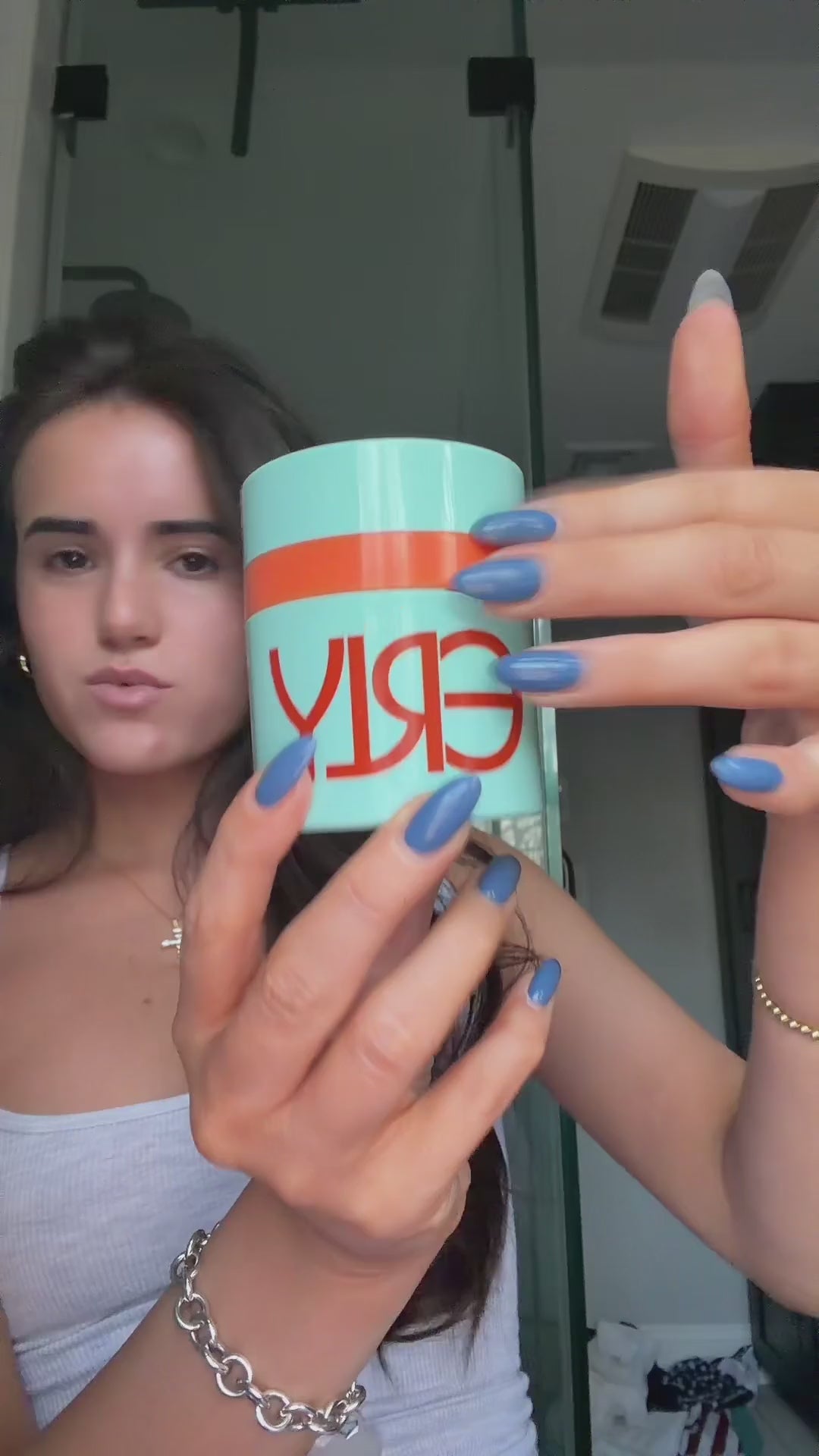Woman applying ERLY Start Moisturizer with SPF 40 to her face